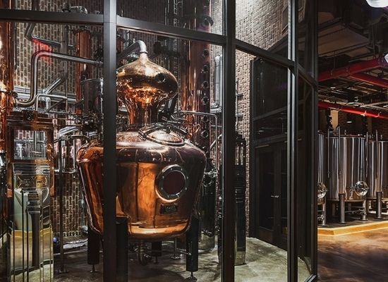 500 gallons pot still surrounded with explosion-proof glass at The Great Jones Distillery